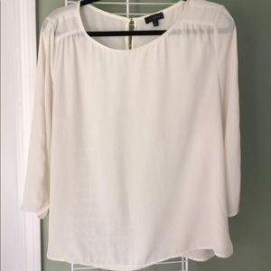 Cream blouse with back button enclosure